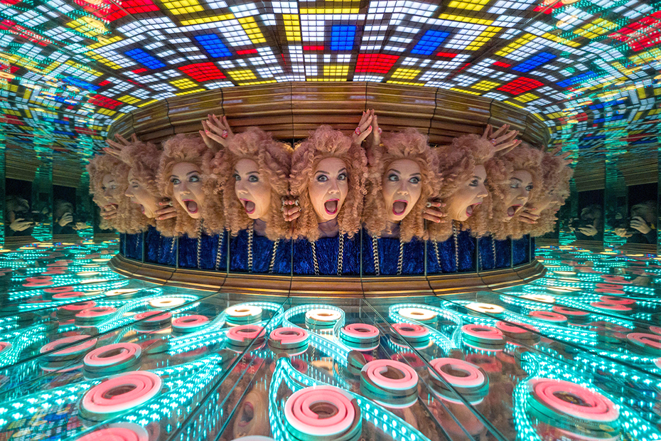 Miss Frisky, star of the show Frisky's Reshuffle, explores the kaleidoscope at the Camera Obscura & World of Illusions in Edinburgh during the Edinburgh Fringe Festival.